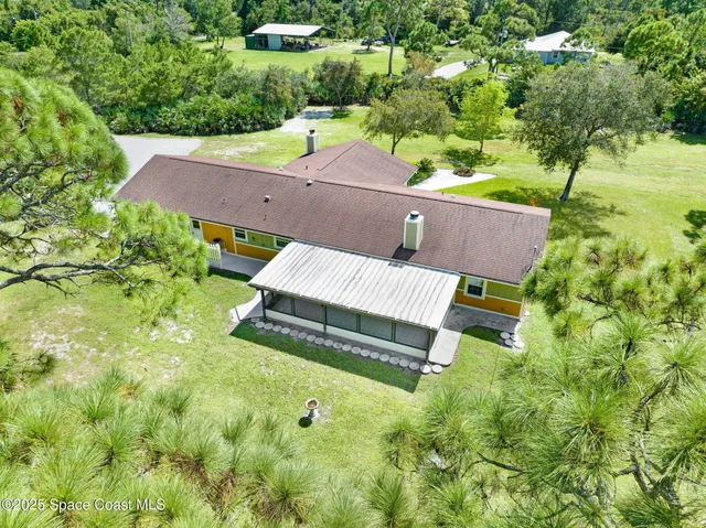 a view of an empty room with a floor to ceiling window