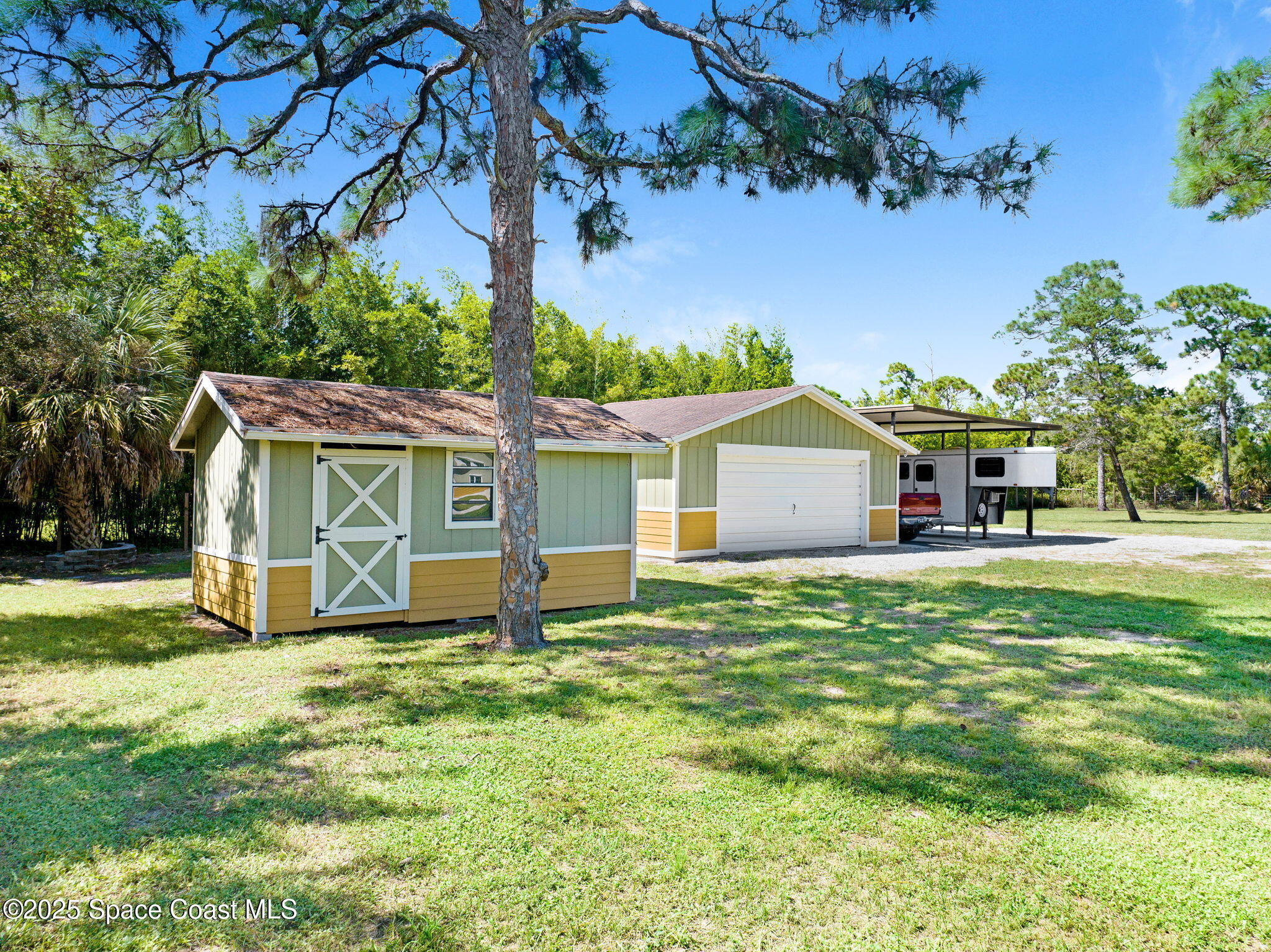 6570 Whispering Pines Lane Grant, FL 32949 - Photo 19 of 62 a house view with a garden space