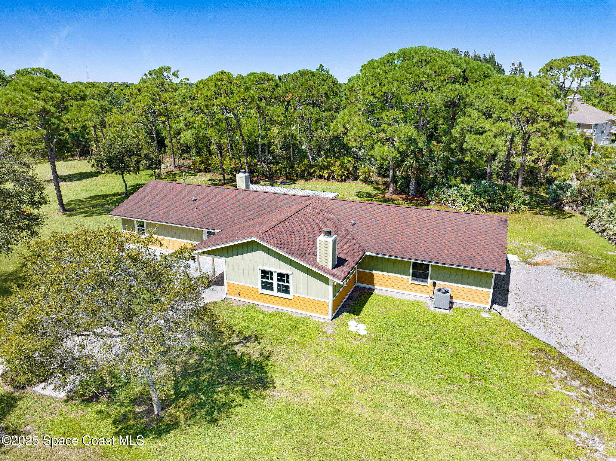 6570 Whispering Pines Lane Grant, FL 32949 - Photo 2 of 62 an aerial view of a house with swimming pool garden and outdoor seating