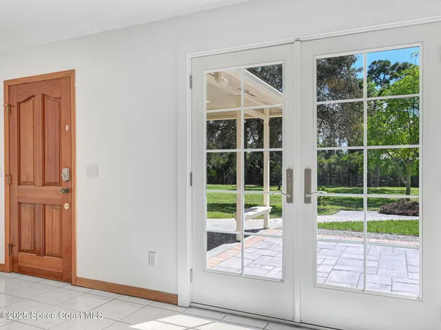 a view of an empty room with a garage