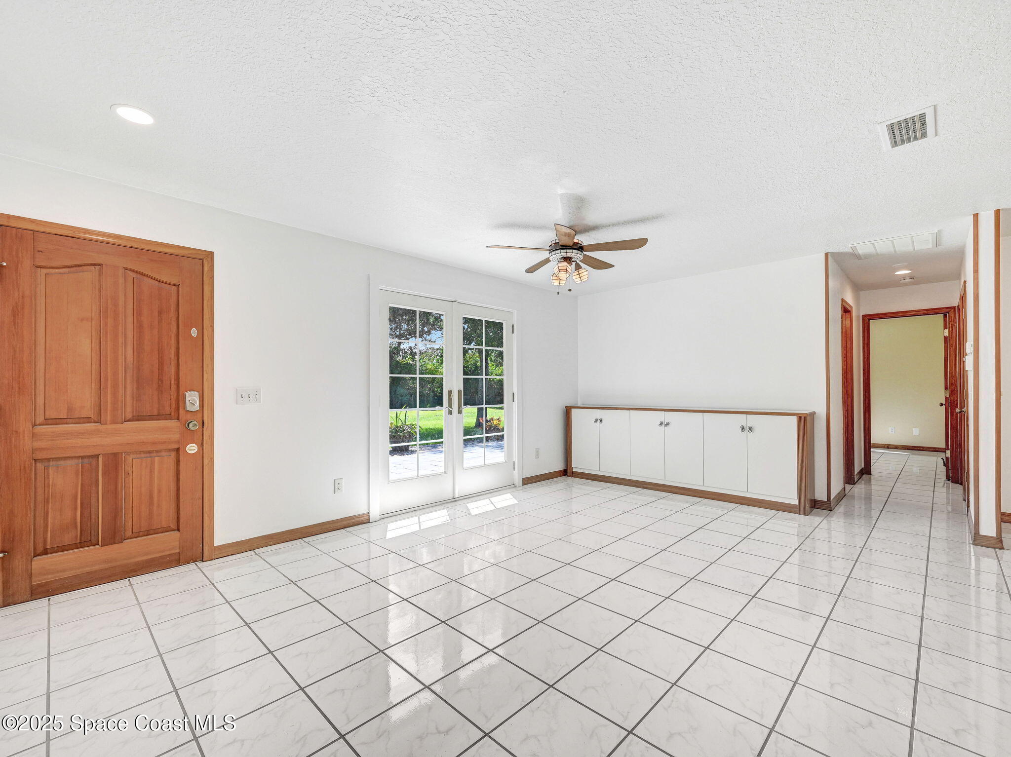 6570 Whispering Pines Lane Grant, FL 32949 - Photo 27 of 62 a view of a livingroom with an empty space and a window