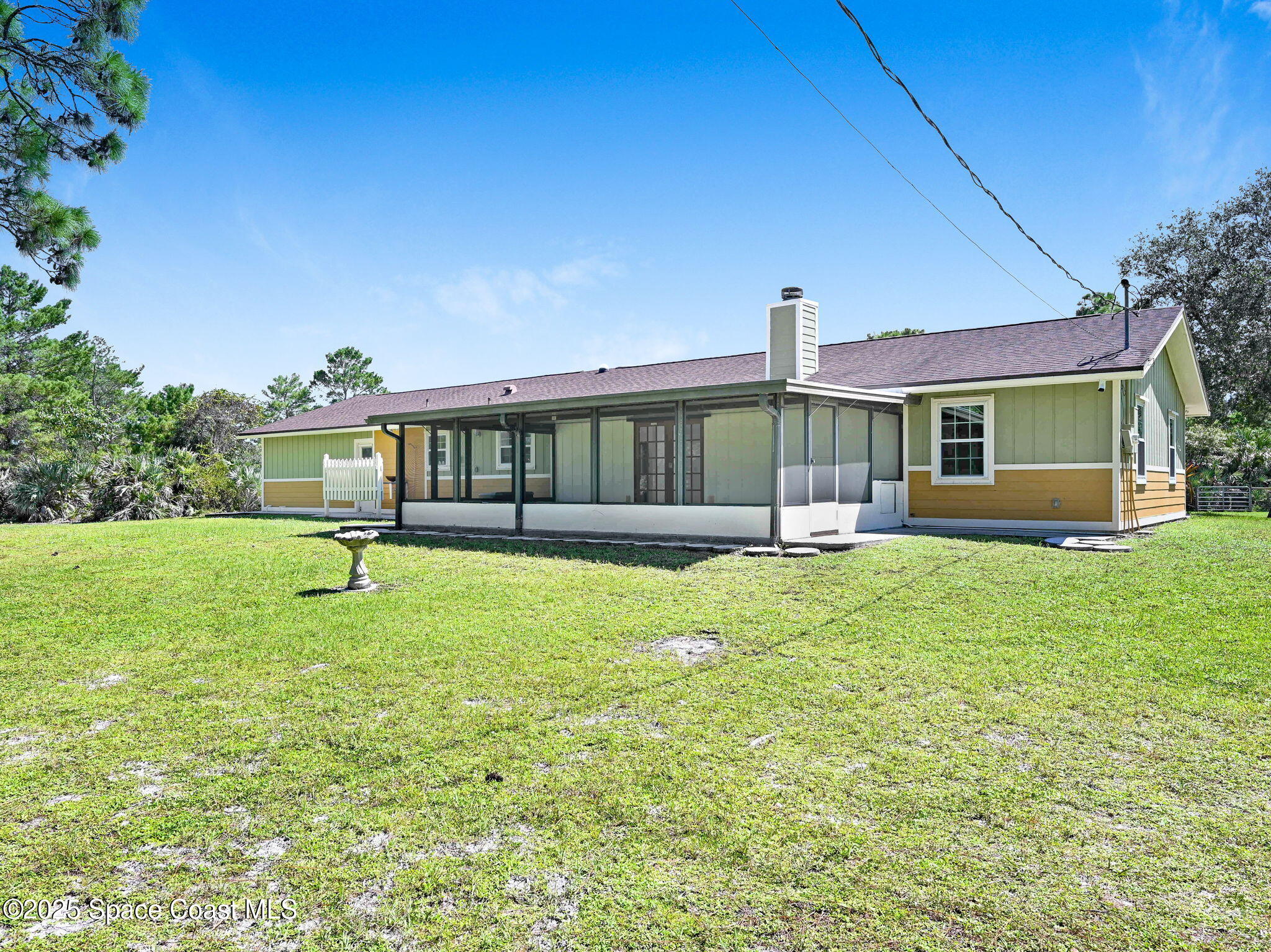 6570 Whispering Pines Lane Grant, FL 32949 - Photo 3 of 62 a view of swimming pool with a garden and plants