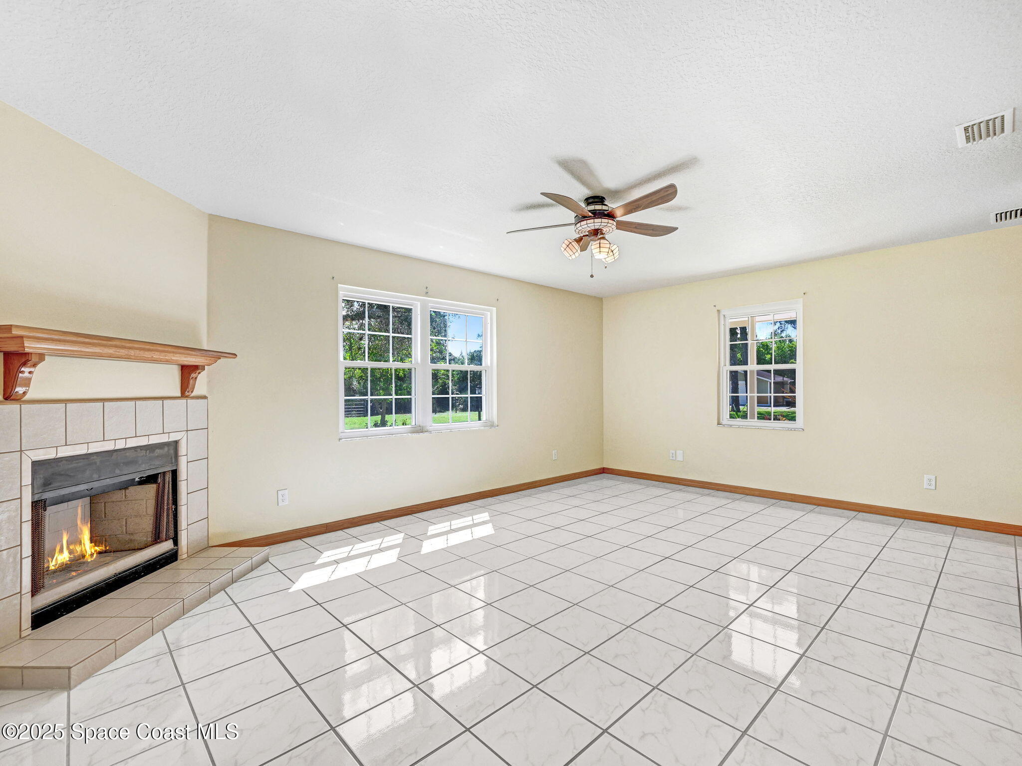6570 Whispering Pines Lane Grant, FL 32949 - Photo 35 of 62 a view of an empty room with a fireplace