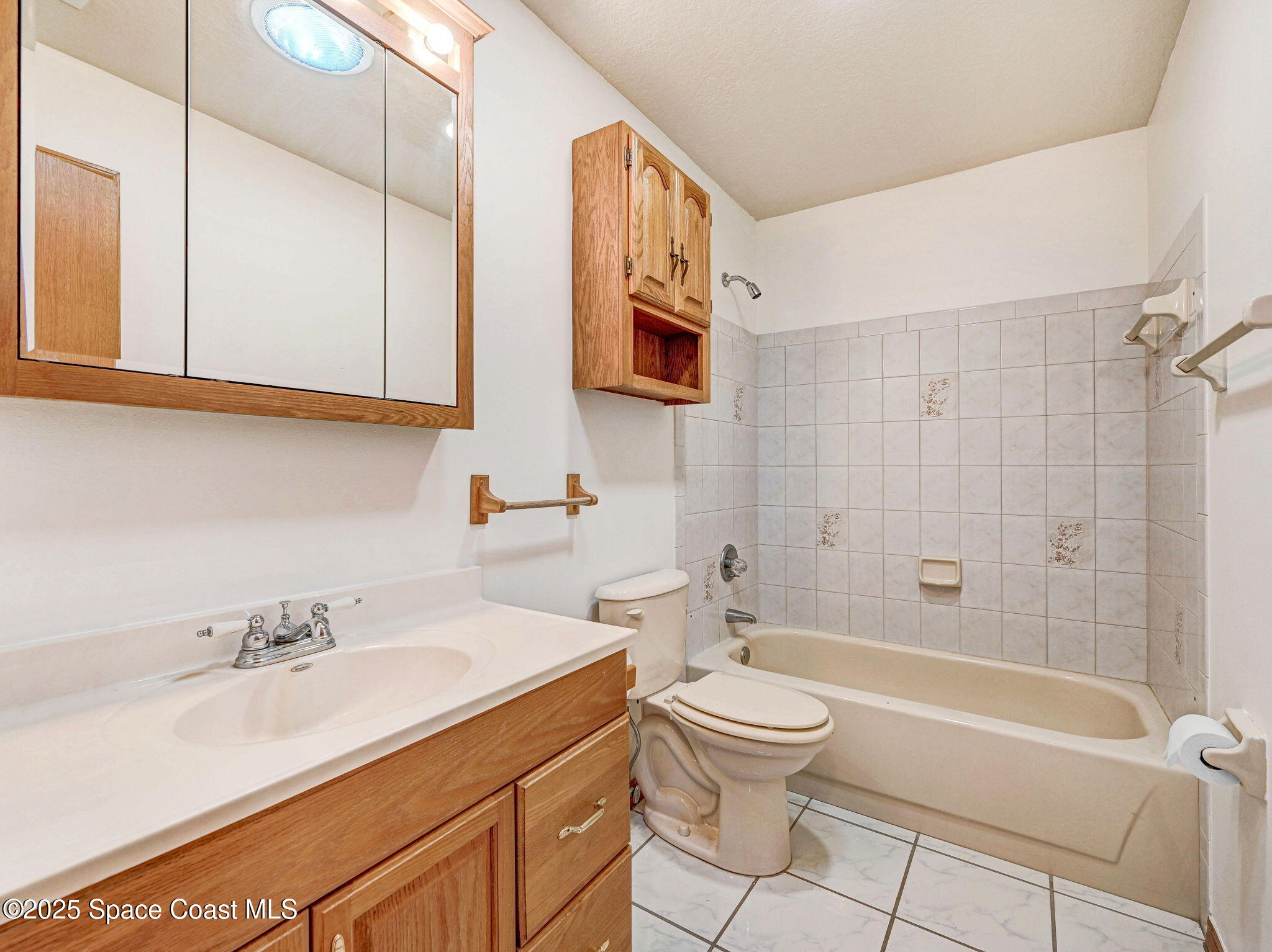 6570 Whispering Pines Lane Grant, FL 32949 - Photo 42 of 62 a bathroom with a sink toilet and shower