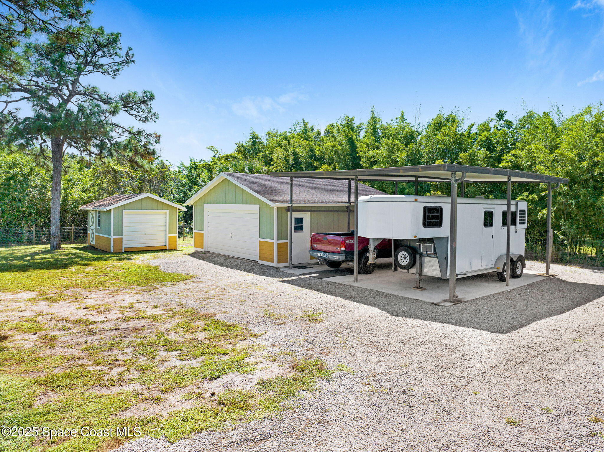 6570 Whispering Pines Lane Grant, FL 32949 - Photo 6 of 62 a view of a house with backyard and a tree