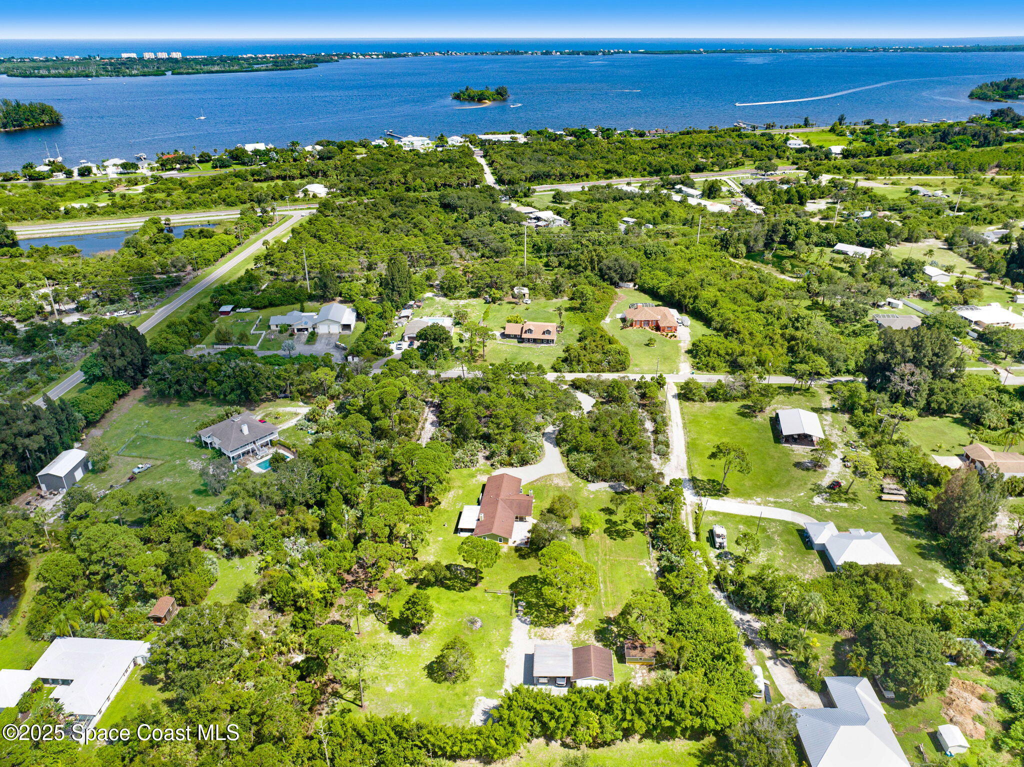 6570 Whispering Pines Lane Grant, FL 32949 - Photo 8 of 62 a view of a large body of water with lots of green space