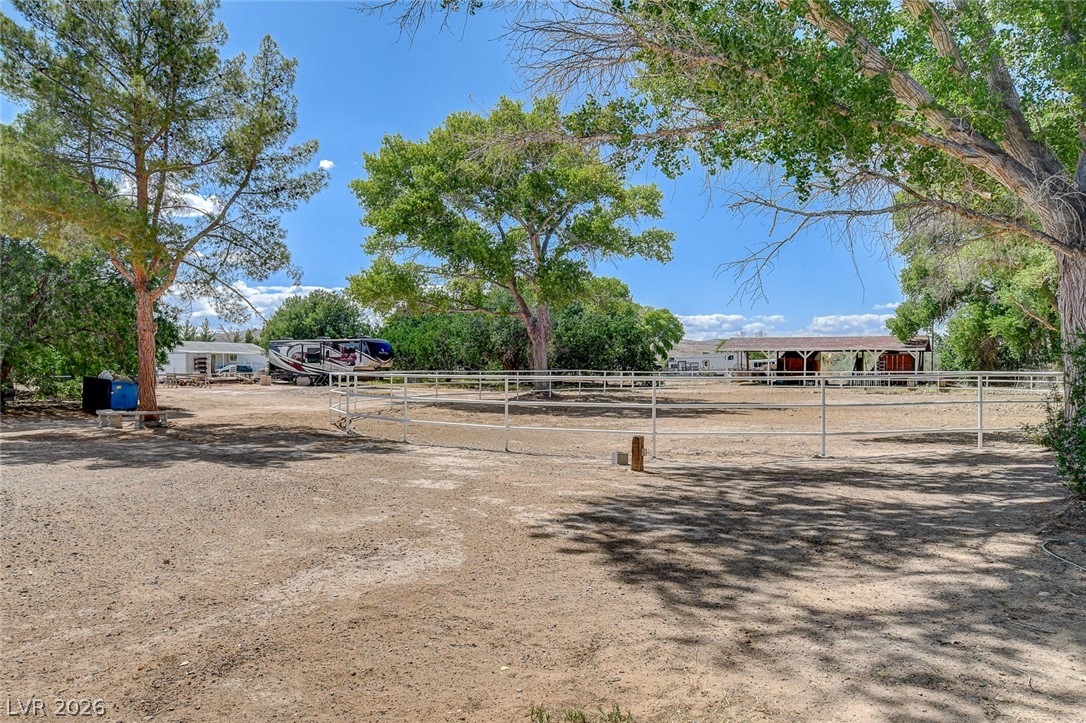 1950 Bowman Road Logandale, NV 89021 - Photo 54 of 81 A spacious, fenced property with mature trees provides ample space for equestrian pursuits.