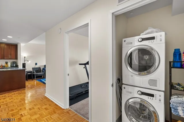 a view of a hallway with washer and dryer