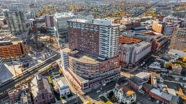 an aerial view of a building with a city street