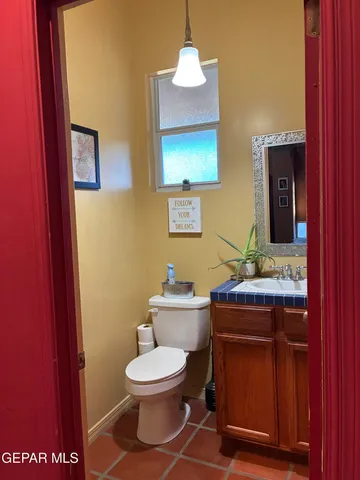 a living room with furniture a flat screen tv and rug floor