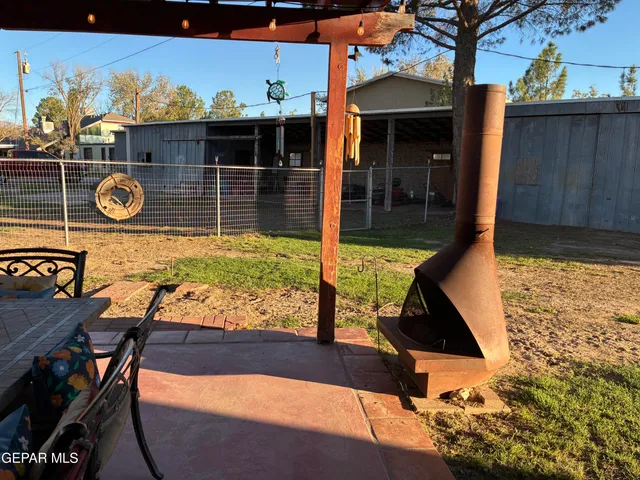 a living room with furniture a rug and a flat screen tv