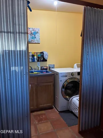 a view of a house with a yard and garage