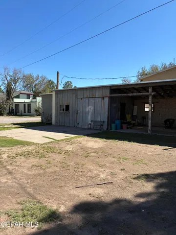 a living room filled with furniture and a chandelier
