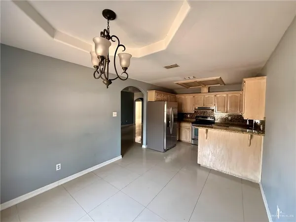 a view of a kitchen with a sink and cabinets