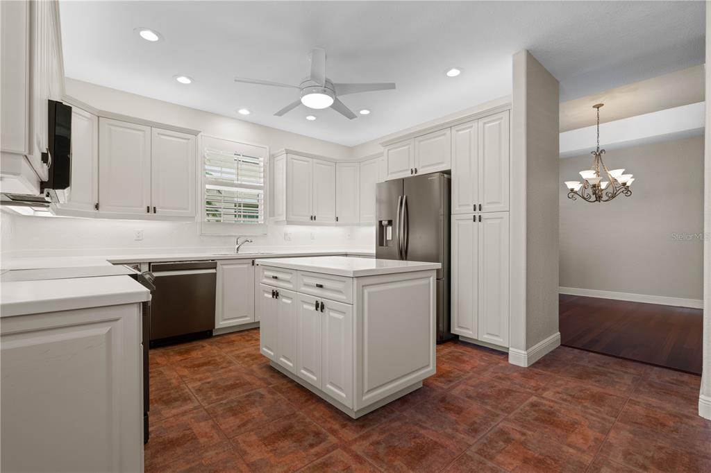 143 Tropicana Drive, Unit 1012 Punta Gorda, FL 33950 - Photo 26 of 55 a kitchen with a sink stove and refrigerator
