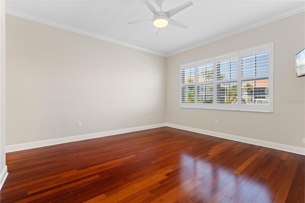 143 Tropicana Drive, Unit 1012 Punta Gorda, FL 33950 - Photo 28 of 55 a view of an empty room with wooden floor and a window