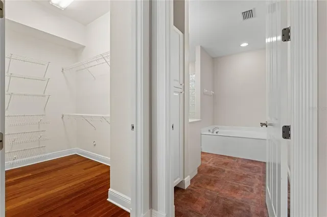 a bathroom with a double vanity sink and mirror