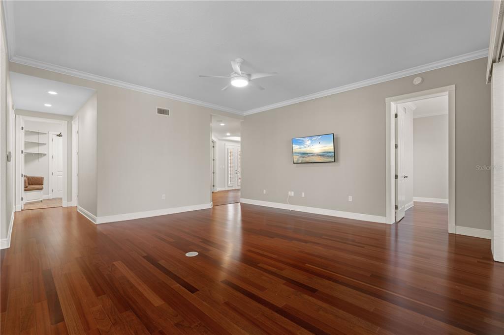 143 Tropicana Drive, Unit 1012 Punta Gorda, FL 33950 - Photo 3 of 55 a view of an empty room with wooden floor and a window