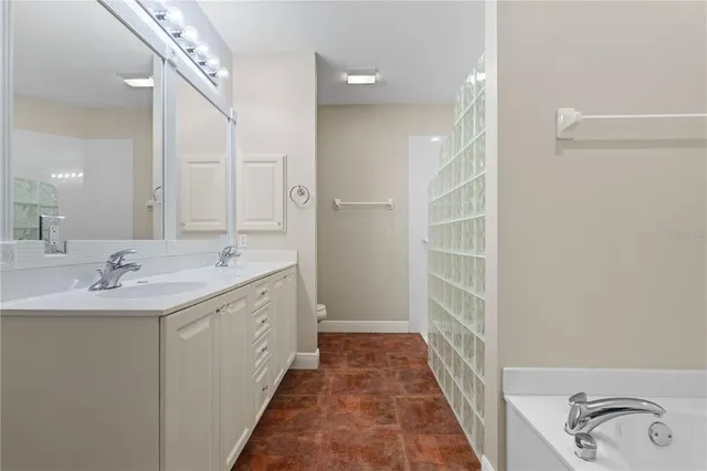 a bathroom with a shower a toilet and a shower