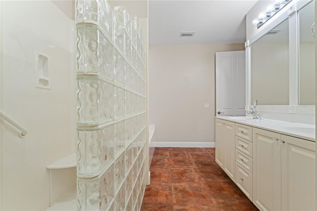 143 Tropicana Drive, Unit 1012 Punta Gorda, FL 33950 - Photo 33 of 55 a bathroom with a double vanity sink and mirror