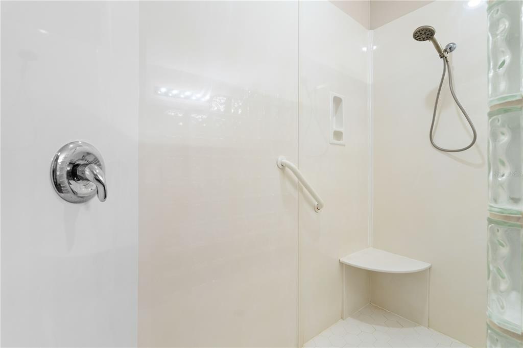 143 Tropicana Drive, Unit 1012 Punta Gorda, FL 33950 - Photo 34 of 55 a bathroom with a shower a toilet and a shower