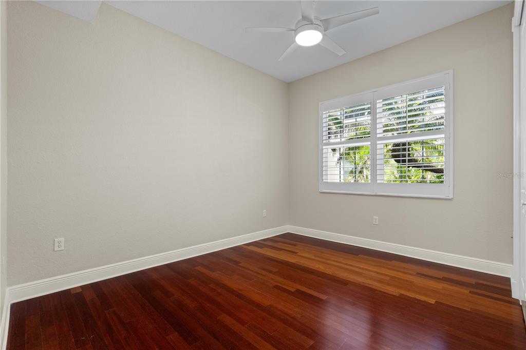 143 Tropicana Drive, Unit 1012 Punta Gorda, FL 33950 - Photo 35 of 55 wooden floor in an empty room with a window