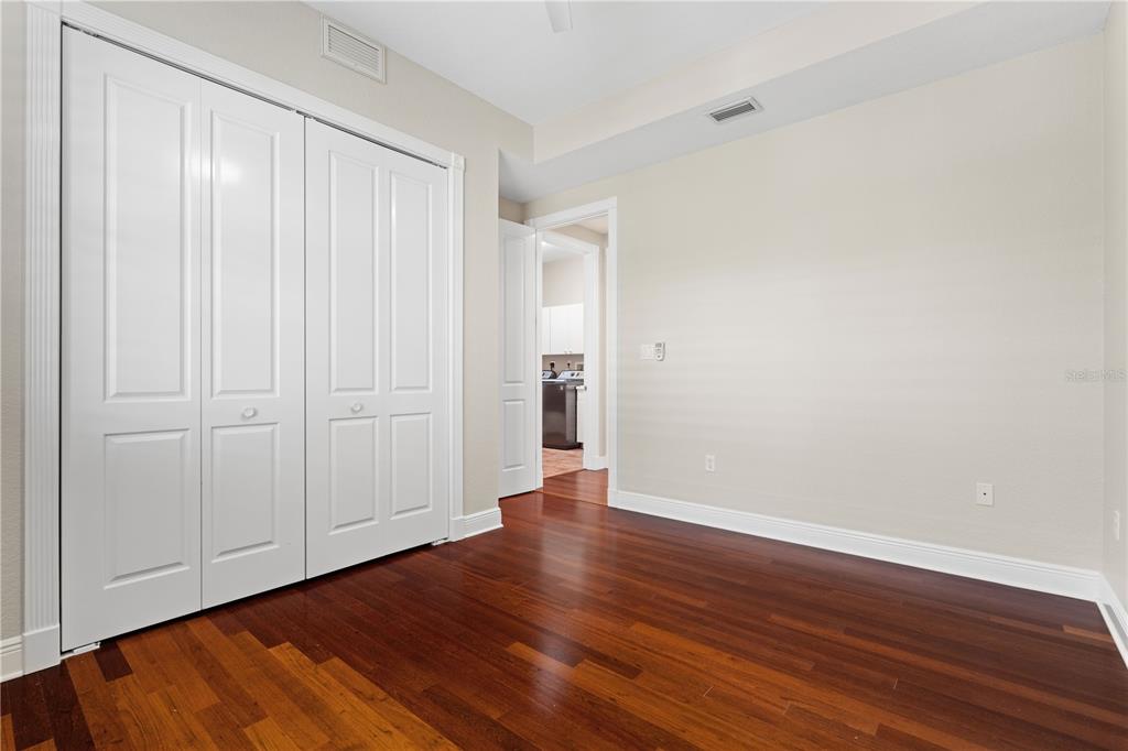 143 Tropicana Drive, Unit 1012 Punta Gorda, FL 33950 - Photo 36 of 55 a view of an empty room with wooden floor