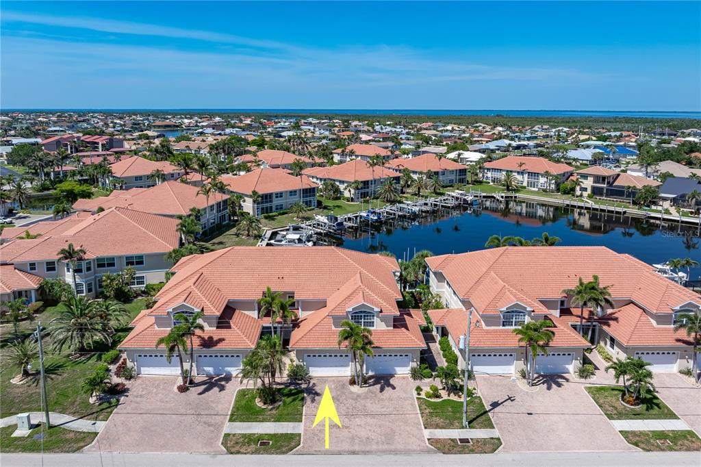 143 Tropicana Drive, Unit 1012 Punta Gorda, FL 33950 - Photo 4 of 55 an aerial view of a house with a ocean view