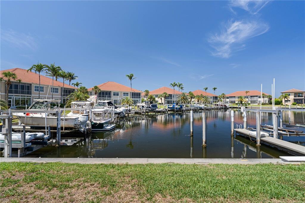 143 Tropicana Drive, Unit 1012 Punta Gorda, FL 33950 - Photo 45 of 55 a swimming pool view with a lake view