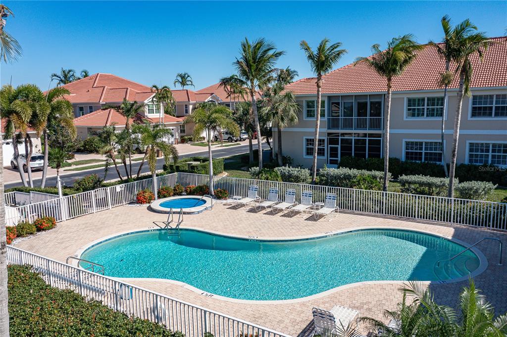 143 Tropicana Drive, Unit 1012 Punta Gorda, FL 33950 - Photo 6 of 55 a view of a patio with a table and chairs under an umbrella