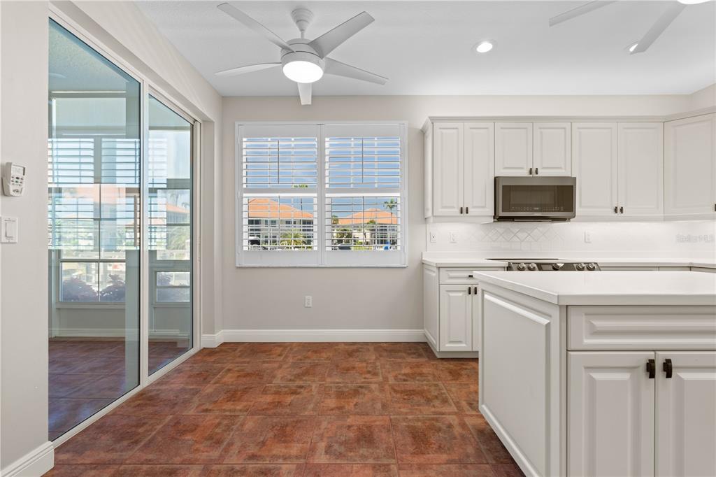 143 Tropicana Drive, Unit 1012 Punta Gorda, FL 33950 - Photo 8 of 55 a kitchen with stainless steel appliances granite countertop a stove and a refrigerator