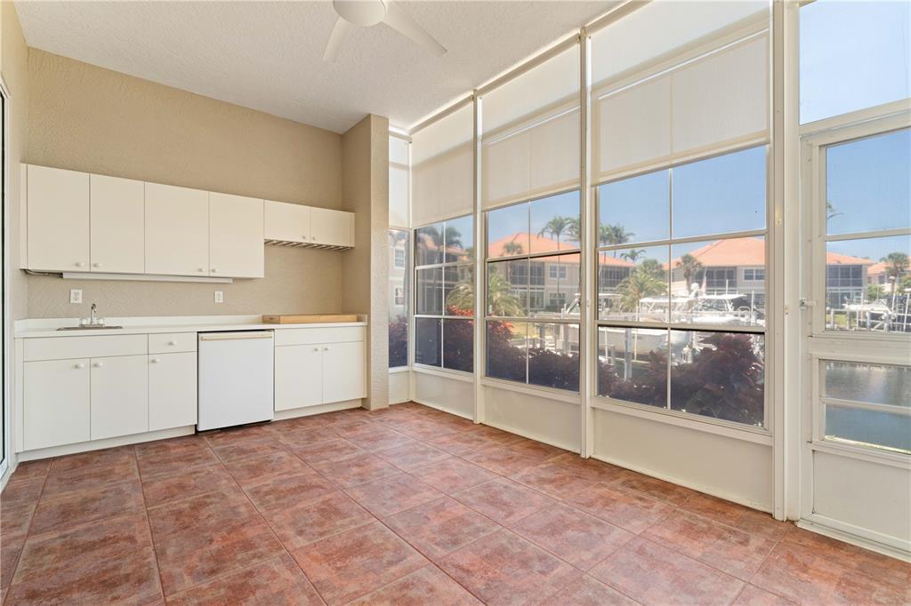 143 Tropicana Drive, Unit 1012 Punta Gorda, FL 33950 - Photo 10 of 55 a view of a kitchen with a sink and cabinets