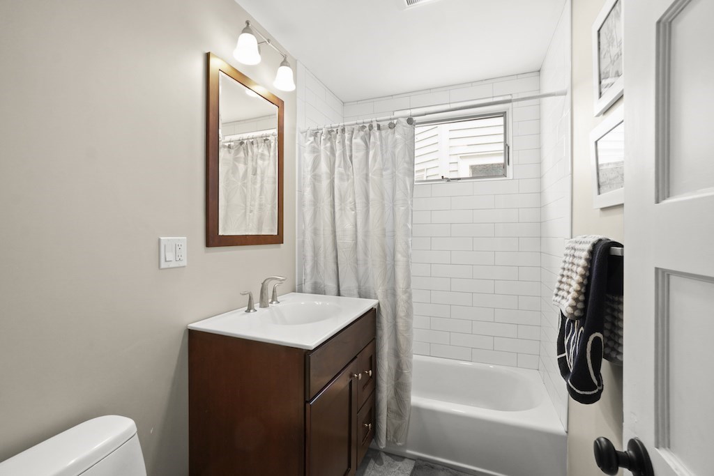 155 Boston Street, Unit 3 Boston, MA 02125 - Photo 11 of 15 a bathroom with a sink a toilet and shower
