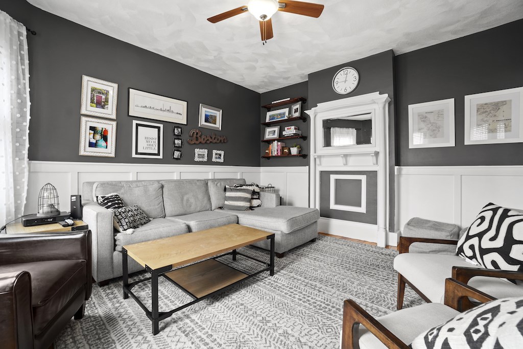 155 Boston Street, Unit 3 Boston, MA 02125 - Photo 5 of 15 a living room with furniture and a fireplace