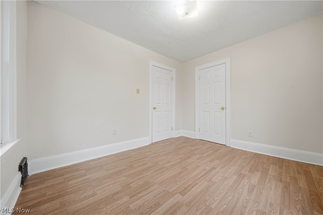 225 Cranz Place Akron, OH 44310 - Photo 20 of 34 Unfurnished room with wood finished floors and baseboards