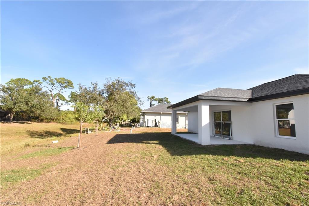 5051 Foxhall Road North Port, FL 34288 - Photo 13 of 27 a view of a house with a yard covered with snow in front of it