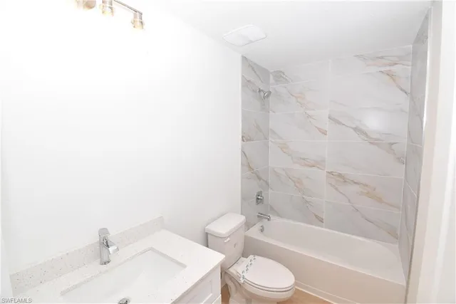 a bathroom with a toilet a sink and a bathtub