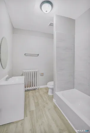 a bathroom with a sink a toilet and a bathtub