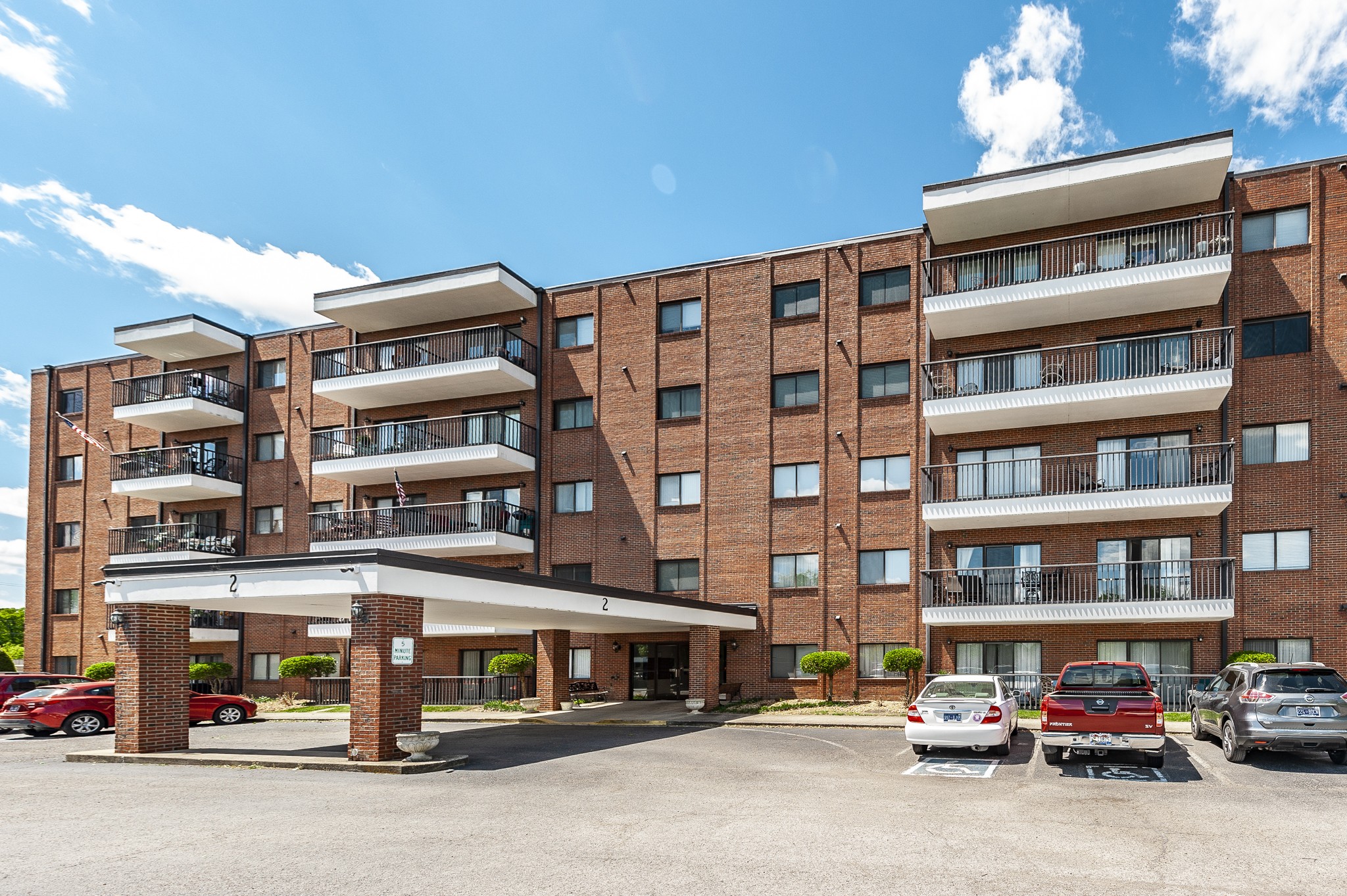 a front view of a building with lot of windows