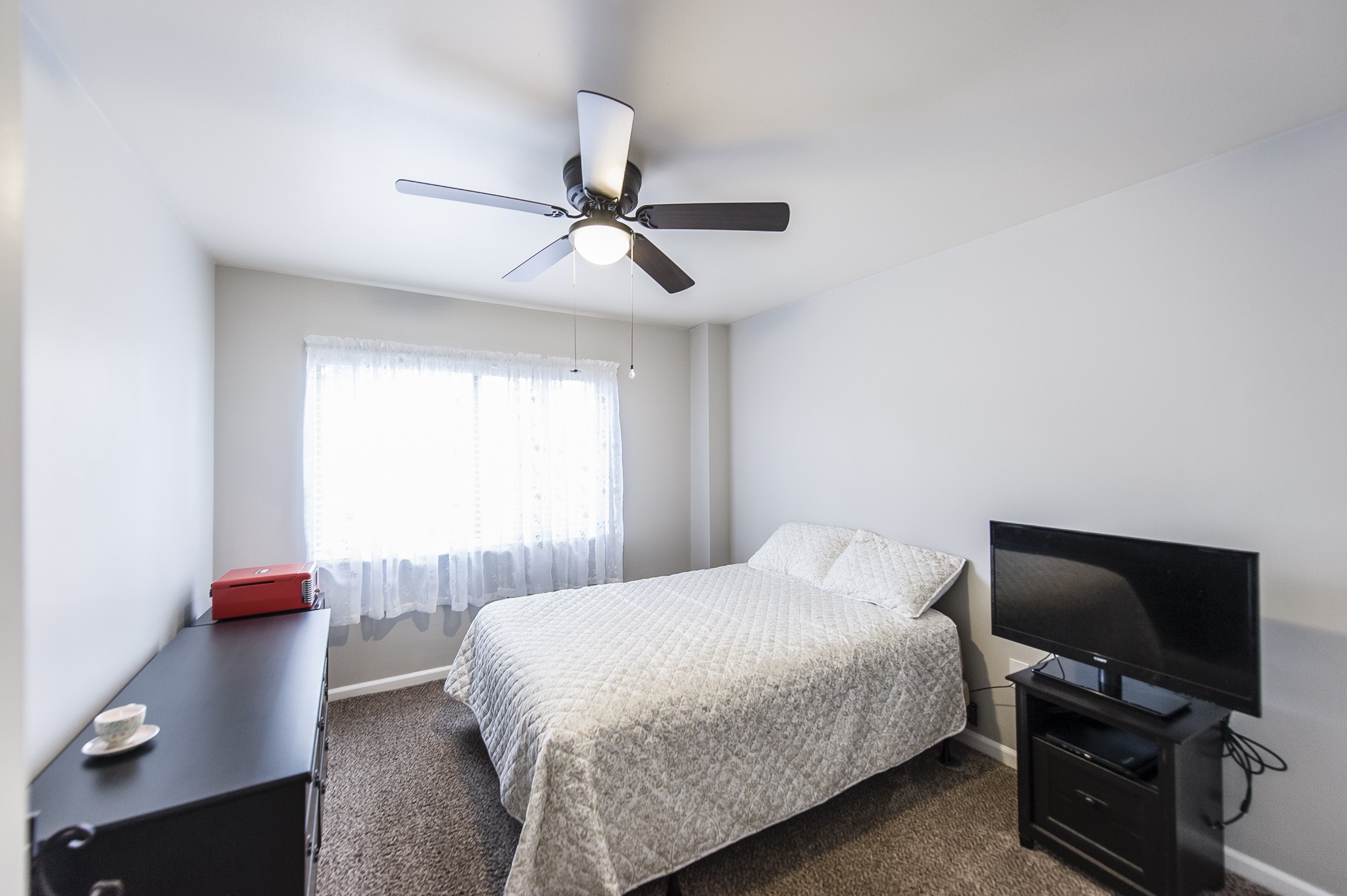 200 Sanders Ferry Road, Unit 2103 Hendersonville, TN 37075 - Photo 16 of 53 a bedroom with a bed and a flat screen tv