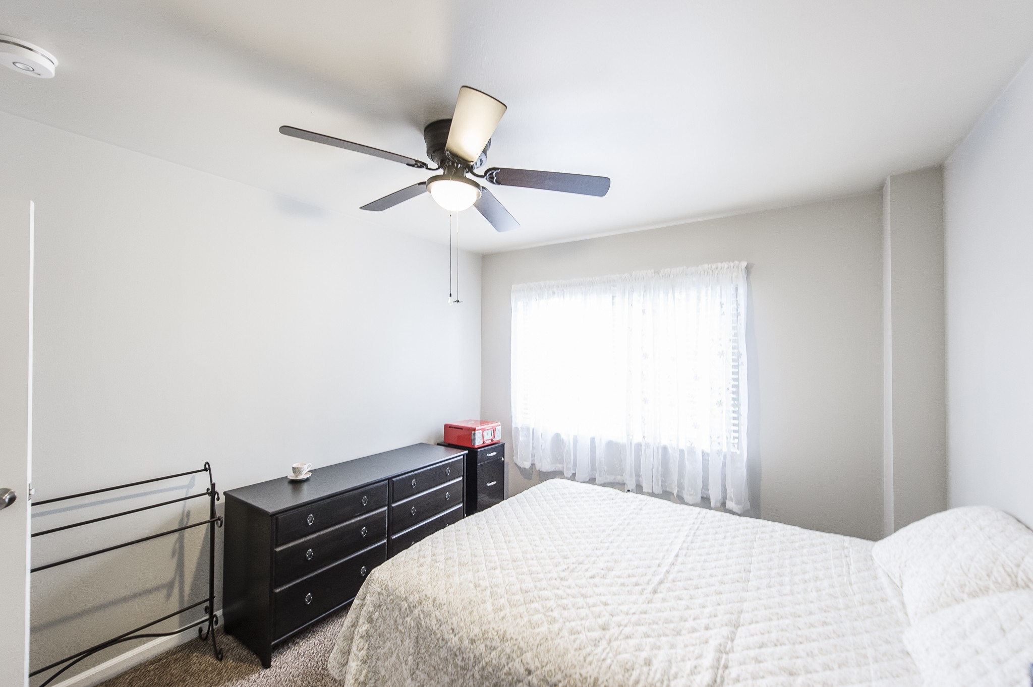 200 Sanders Ferry Road, Unit 2103 Hendersonville, TN 37075 - Photo 18 of 53 a bedroom with a bed and a ceiling fan