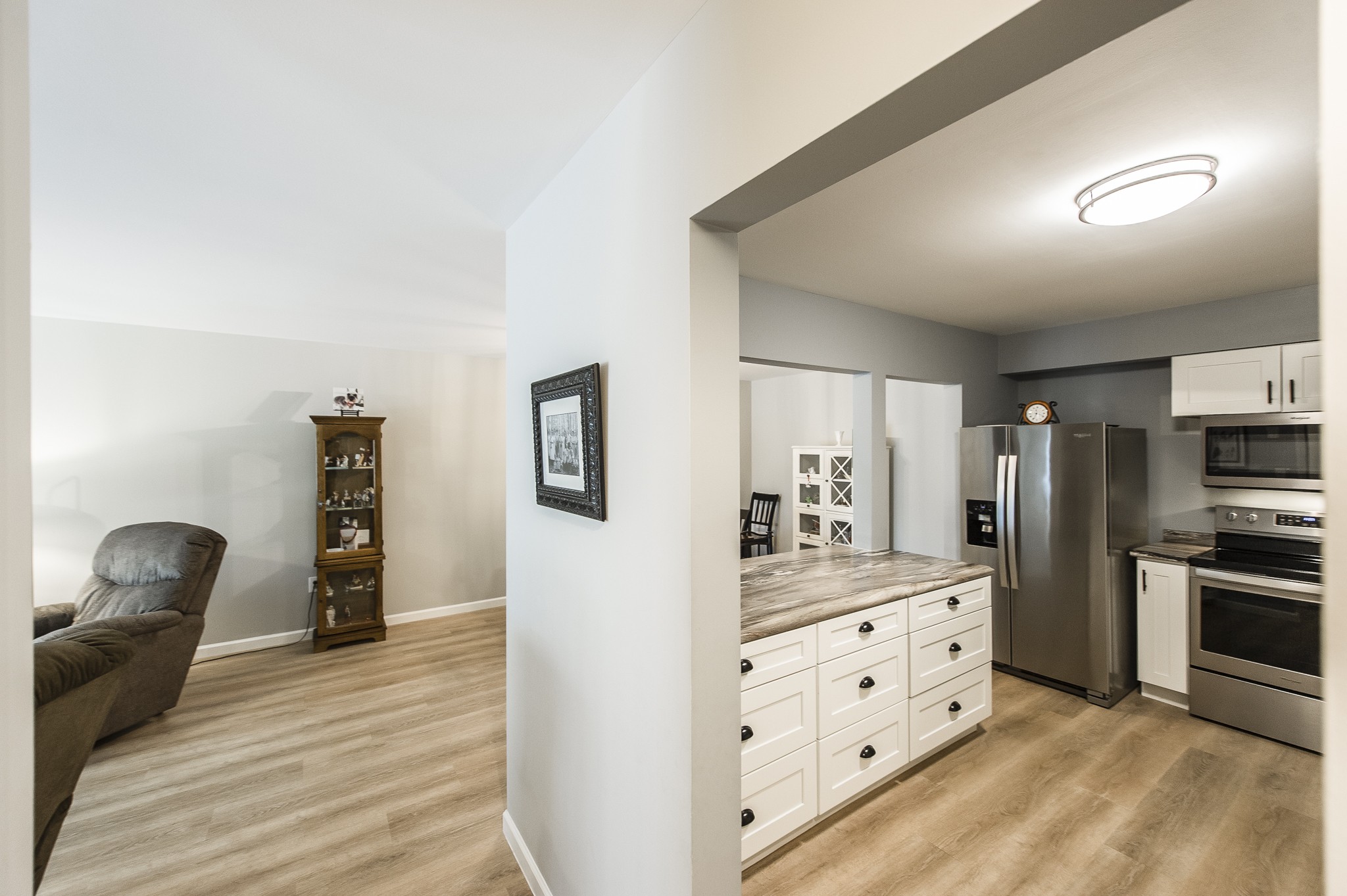 200 Sanders Ferry Road, Unit 2103 Hendersonville, TN 37075 - Photo 26 of 53 a kitchen with stainless steel appliances kitchen island granite countertop a refrigerator and a stove top oven