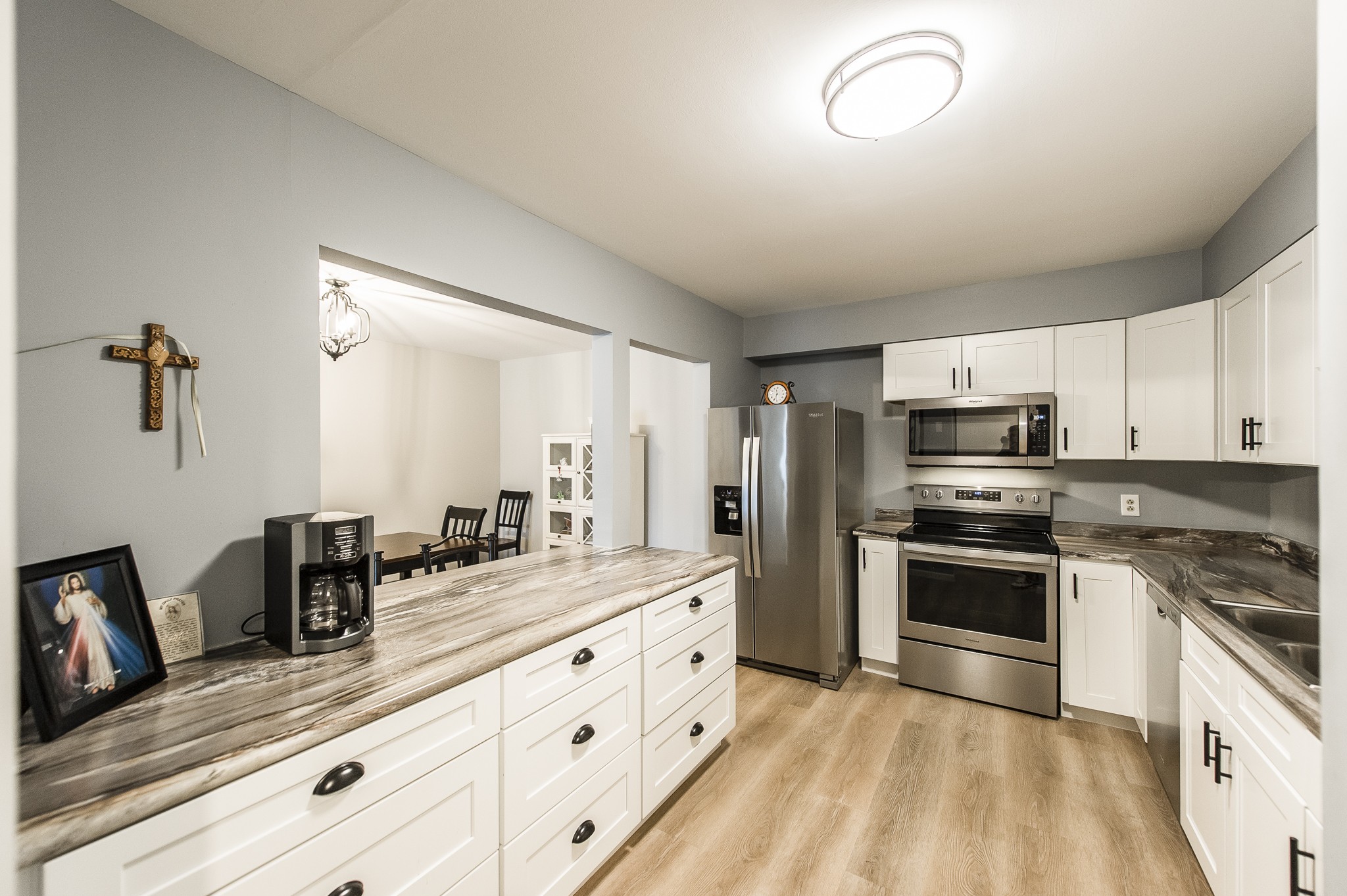 200 Sanders Ferry Road, Unit 2103 Hendersonville, TN 37075 - Photo 27 of 53 a kitchen with granite countertop a sink stainless steel appliances and cabinets