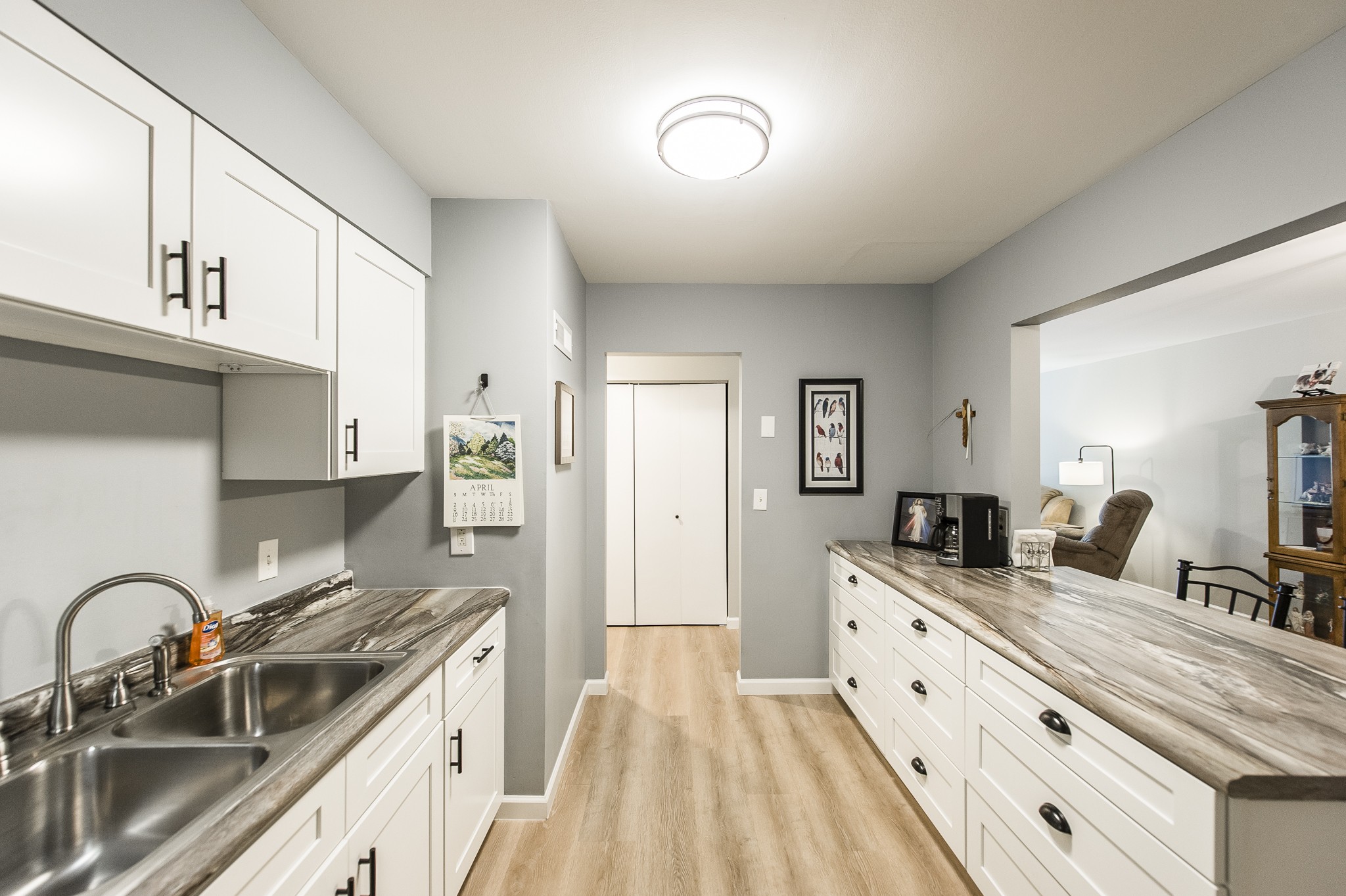 200 Sanders Ferry Road, Unit 2103 Hendersonville, TN 37075 - Photo 31 of 53 a kitchen with granite countertop a sink stove and cabinets