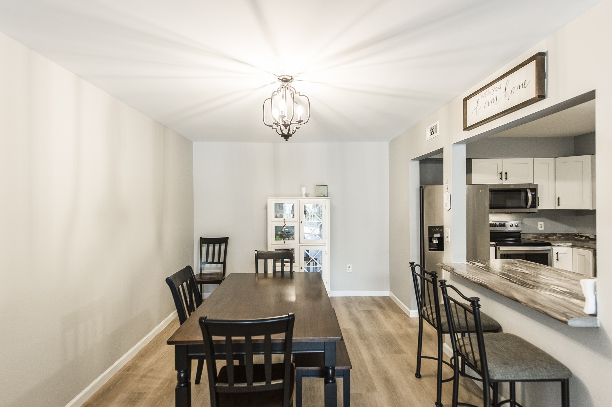 200 Sanders Ferry Road, Unit 2103 Hendersonville, TN 37075 - Photo 33 of 53 a view of a dining room with furniture and wooden floor