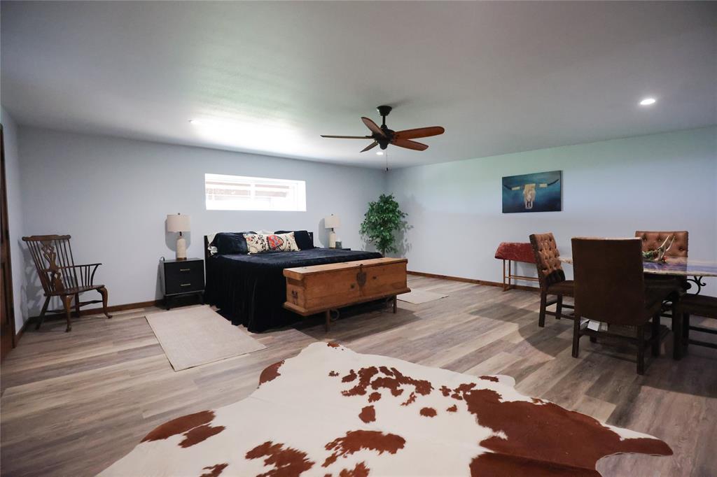 1250 County Road Brady, TX 76825 - Photo 29 of 40 a living room with furniture and a wooden floor