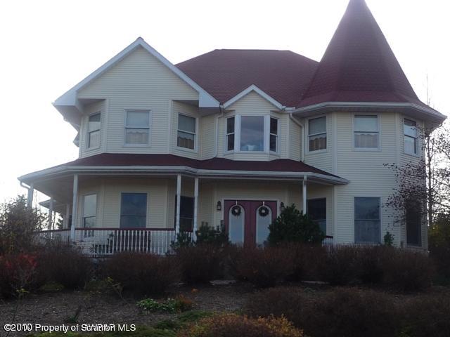 214 Willow Road Pittston, PA 18640 - Photo 1 of 19 a front view of a house with a yard and garage