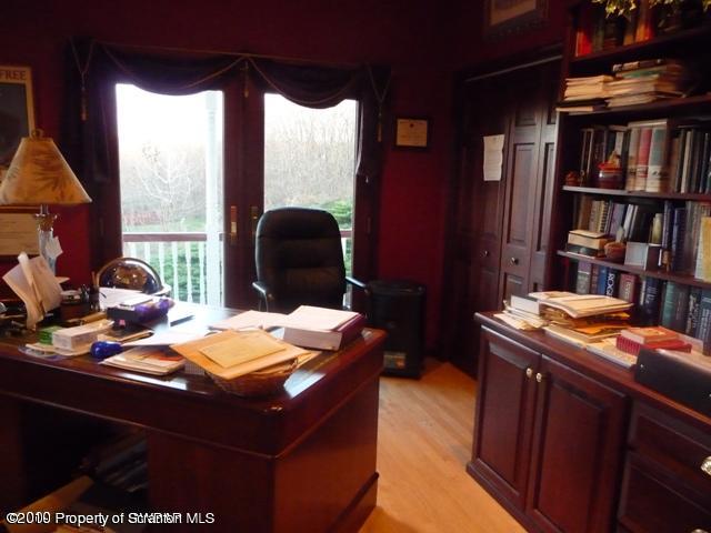 214 Willow Road Pittston, PA 18640 - Photo 11 of 19 a room with a table chairs and a bed