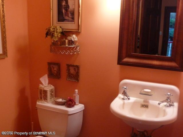 214 Willow Road Pittston, PA 18640 - Photo 12 of 19 a bathroom with a sink mirror and toilet