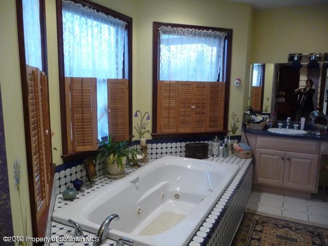 214 Willow Road Pittston, PA 18640 - Photo 14 of 19 a bathroom with a bathtub and a sink